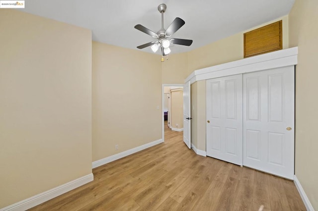 unfurnished bedroom featuring light hardwood / wood-style flooring, a closet, and ceiling fan