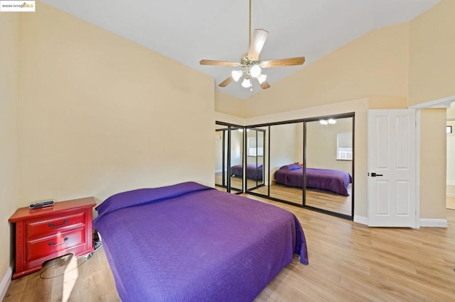 bedroom with vaulted ceiling, light hardwood / wood-style floors, and ceiling fan