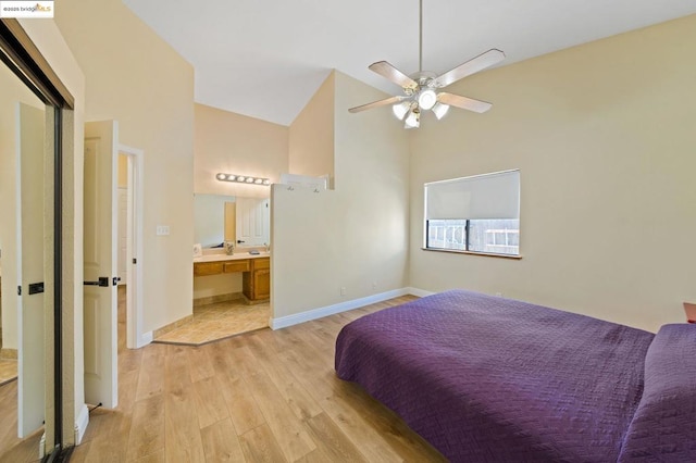 bedroom with sink, connected bathroom, ceiling fan, and light hardwood / wood-style flooring