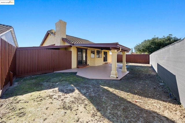 back of property with a patio area