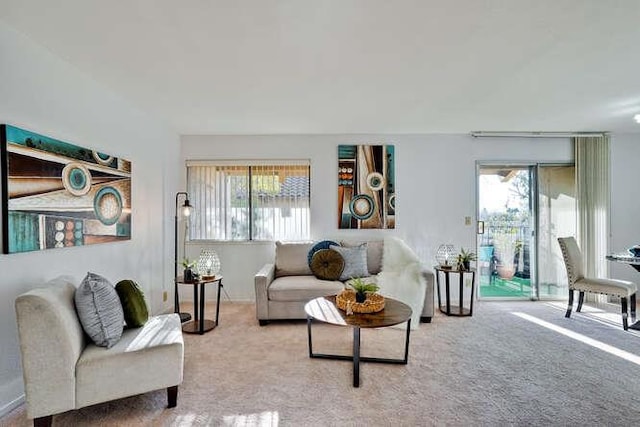 living room with plenty of natural light and carpet flooring