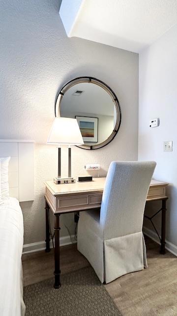 bathroom featuring hardwood / wood-style flooring and a textured ceiling