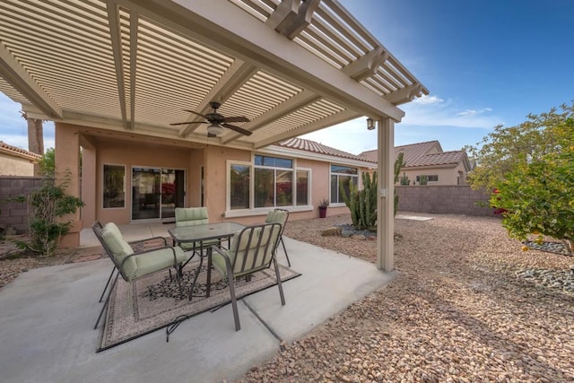 view of patio / terrace with ceiling fan and a pergola