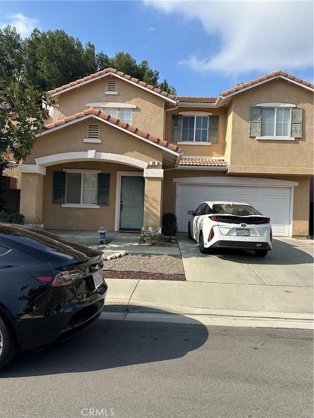 view of front of property with a garage