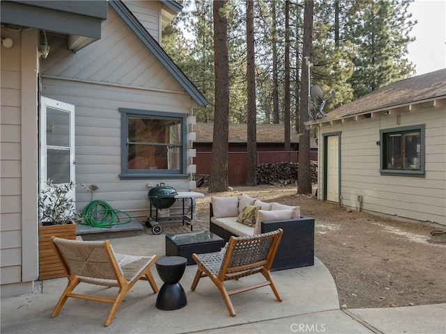 view of patio with grilling area and outdoor lounge area