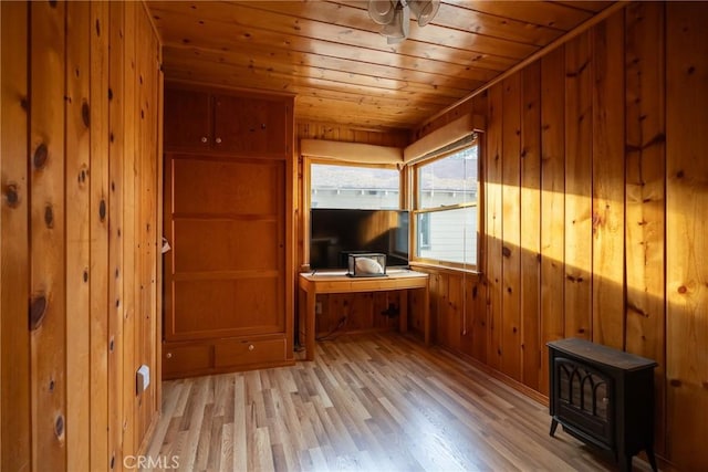 living room featuring wood ceiling, light hardwood / wood-style flooring, and wood walls