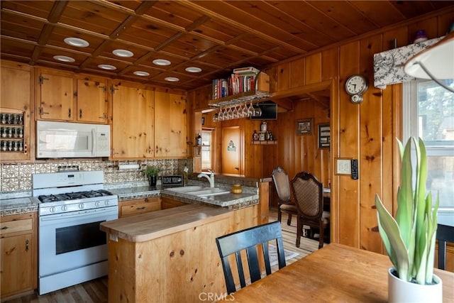 kitchen with wood ceiling, sink, white appliances, and plenty of natural light