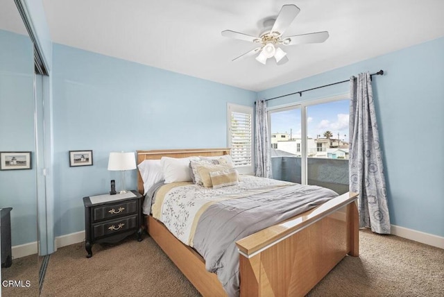 carpeted bedroom with ceiling fan and a closet