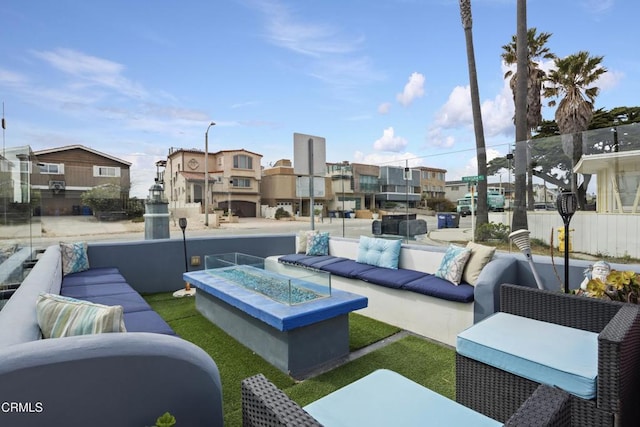 view of patio / terrace featuring an outdoor living space with a fire pit