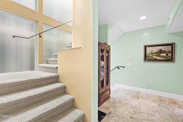 stairs with vaulted ceiling