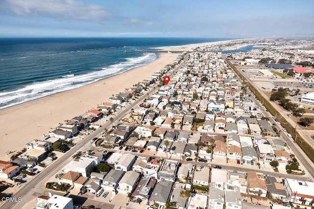 aerial view with a water view and a view of the beach