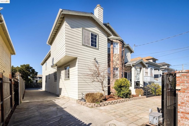 view of property exterior with a patio