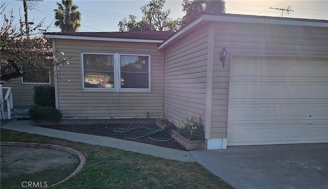 view of side of property featuring a garage