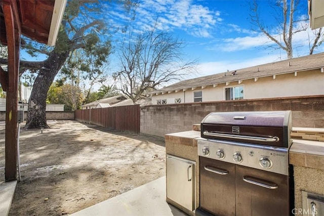 view of patio with an outdoor kitchen