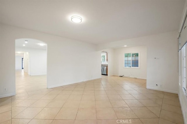 spare room featuring light tile patterned flooring