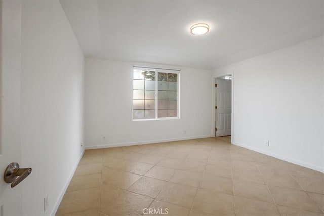 spare room with light tile patterned floors