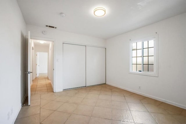 unfurnished bedroom featuring a closet