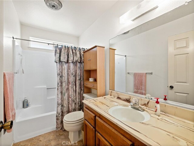 full bathroom with vanity, toilet, and shower / bath combo with shower curtain