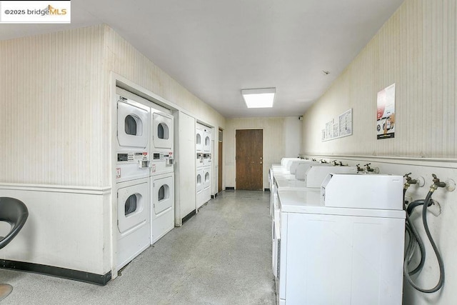 laundry room with stacked washer and dryer and washing machine and dryer