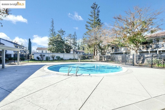 view of pool featuring a patio