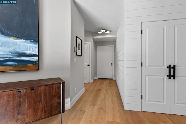 corridor with light wood-type flooring