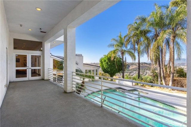 balcony featuring french doors and a mountain view