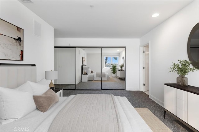 bedroom featuring a closet and carpet flooring