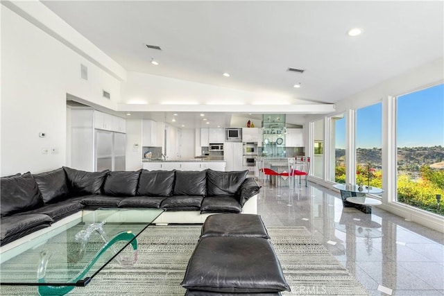 living room featuring a towering ceiling