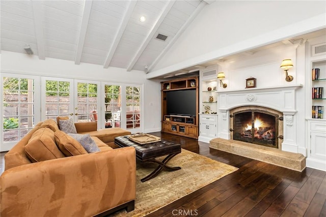 living room with lofted ceiling with beams, a premium fireplace, dark wood-type flooring, and built in features