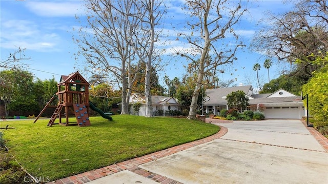 exterior space featuring a garage and a playground