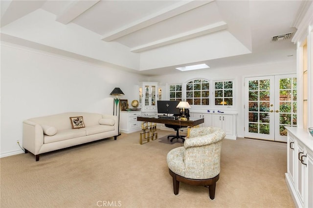 office area with light carpet, a skylight, french doors, and beamed ceiling