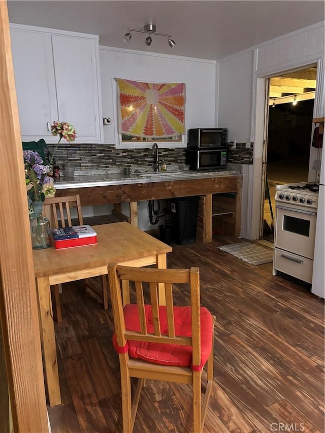 dining room featuring dark wood-style floors