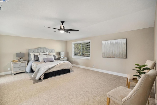 bedroom featuring light colored carpet and ceiling fan