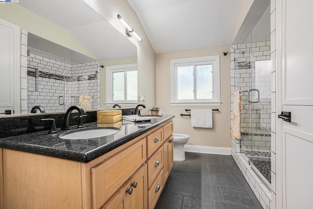 bathroom featuring walk in shower, lofted ceiling, toilet, and vanity