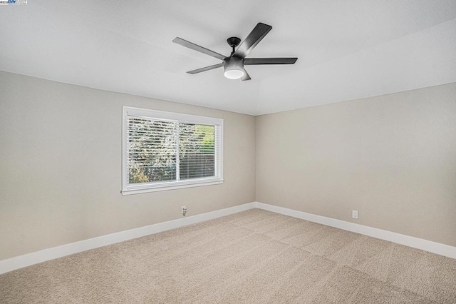 carpeted empty room with ceiling fan