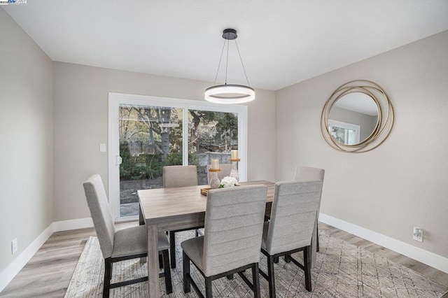 dining area with light hardwood / wood-style flooring