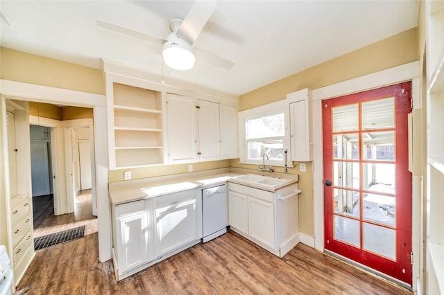 kitchen featuring sink, dishwasher, ceiling fan, light hardwood / wood-style floors, and white cabinets