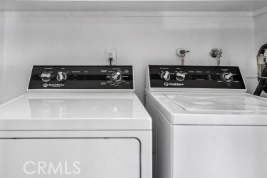 laundry area featuring washing machine and clothes dryer and laundry area