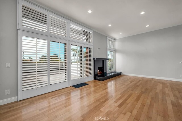 unfurnished living room featuring light wood-type flooring