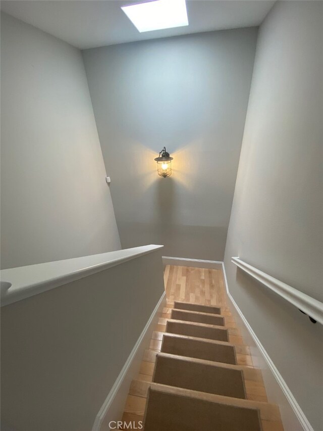 staircase with a skylight