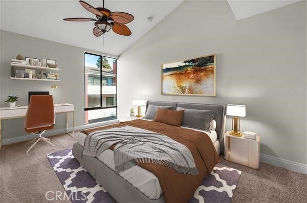 carpeted bedroom with built in desk, high vaulted ceiling, and ceiling fan