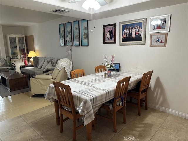 dining room with light tile patterned floors and ceiling fan