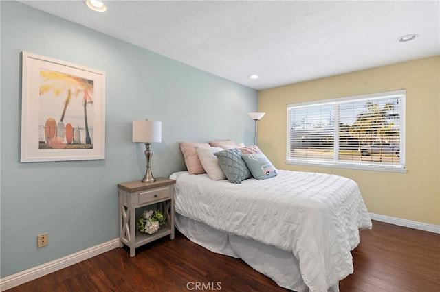 bedroom featuring dark wood-type flooring