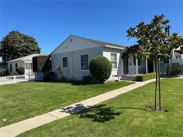 ranch-style home with a front lawn