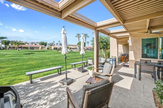 view of patio / terrace featuring ceiling fan