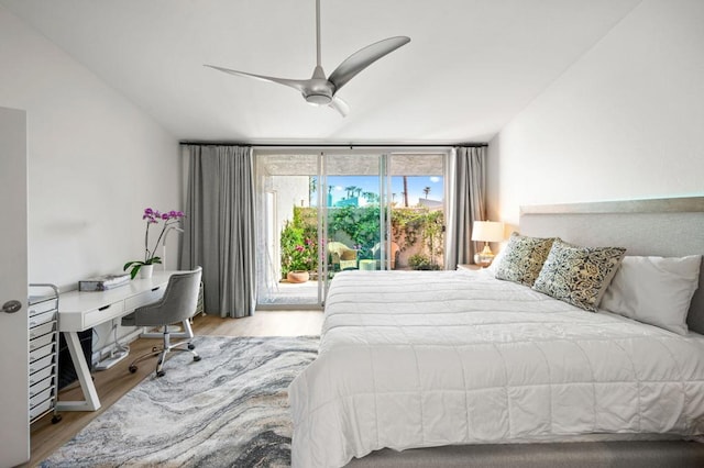 bedroom featuring a wall of windows, access to outside, ceiling fan, and light wood-type flooring