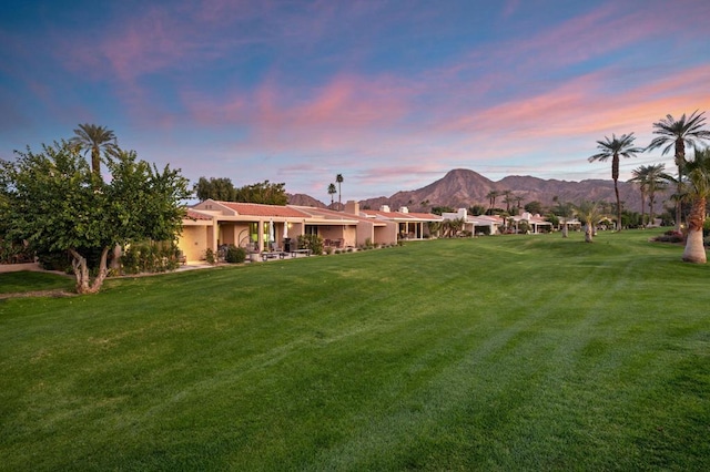 yard at dusk with a mountain view