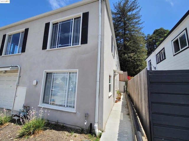 view of side of property with a garage