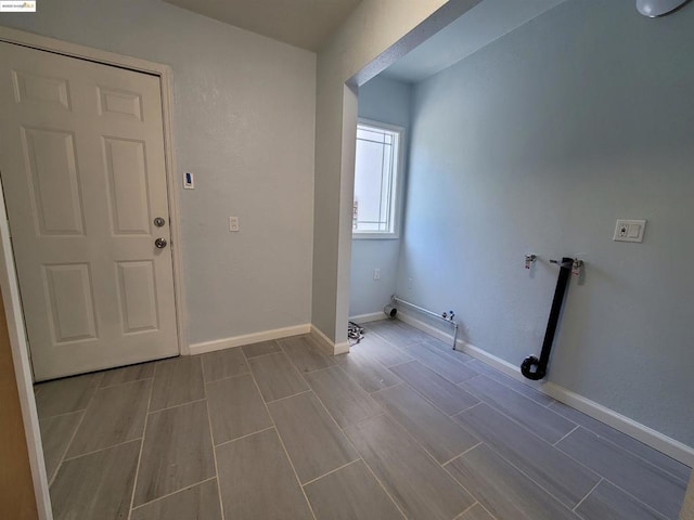 clothes washing area with gas dryer hookup and washer hookup