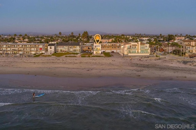 exterior space with a beach view and a water view